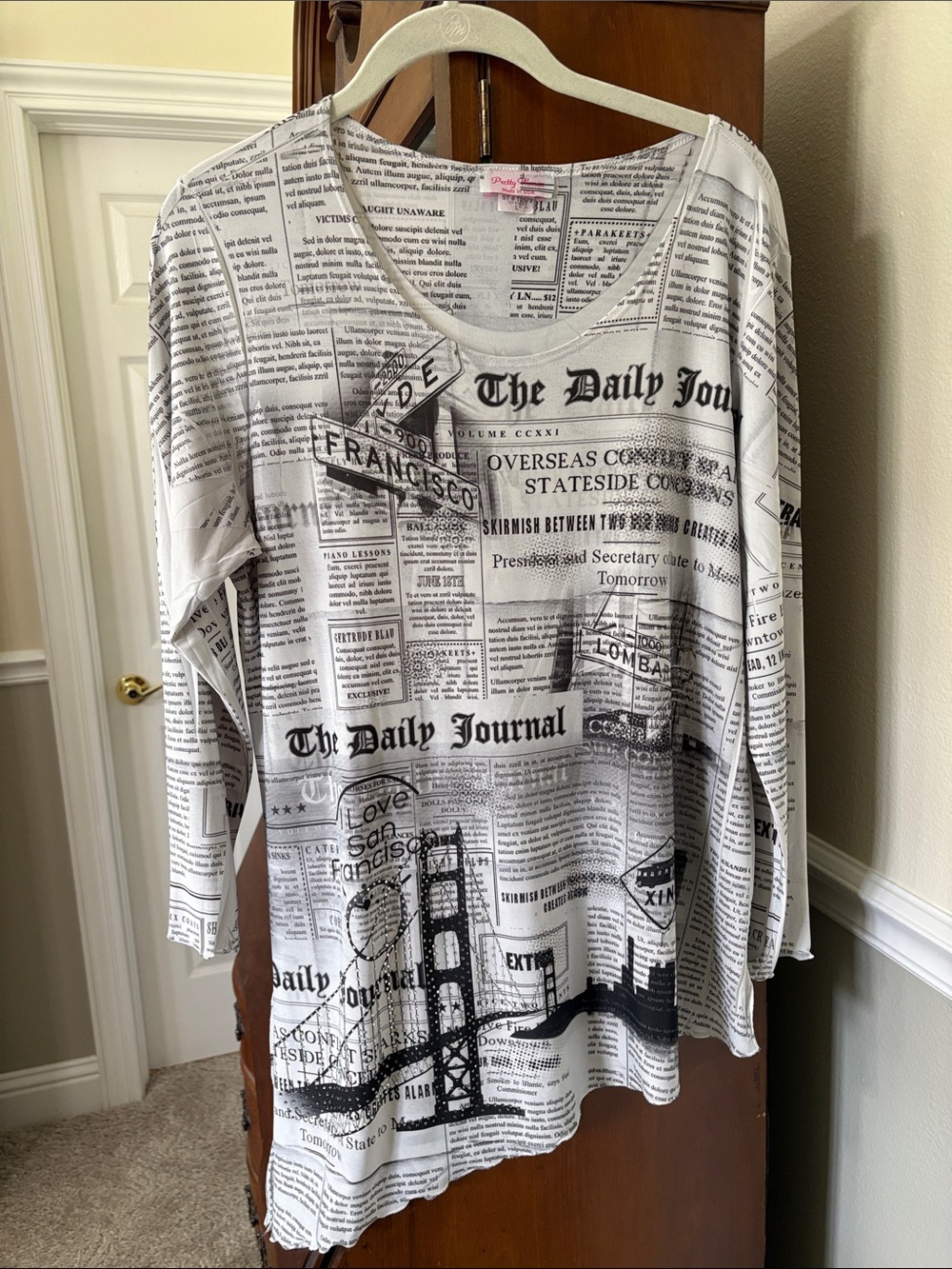*San Fran CA Newspaper Print Scoop Neck Bedazzled Asymmetrical Hem Tunic Top